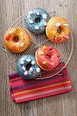 Doughnuts with coloured sugar glaze