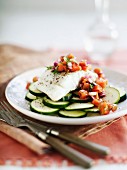 Cod fillet with papaya on sliced courgettes