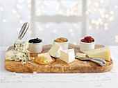 Three types of cheeses with accompanying chutneys
