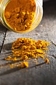 Turmeric powder on a wooden table
