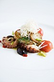 Octopus Gröstl (typical Tirolean dish using leftovers) with fresh seafood and spring onions
