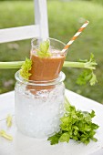 A vegetable smoothie on a garden chair