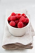 Raspberries in a white bowl