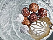 Truffle pralines with light and dark chocolate on a glass plate