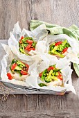 Steamed fish and vegetable parcels