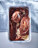 Chocolate and vanilla ice-cream in an aluminium tub