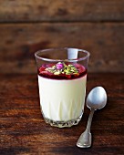 Lemon posset with roses and pistachio nuts
