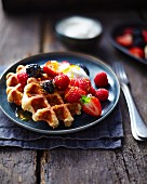 Waffles with vanilla ice-cream and berries