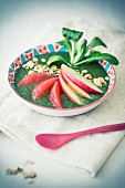 A smoothie bowl with lamb's lettuce, grapefruit and apple