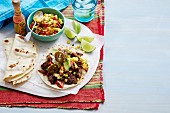 Wheat tortilla with beef and tomato-corn salsa