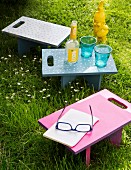 Colourful tray tables with handles for picnics