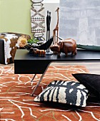 Patterned rug in living room decorated in African style