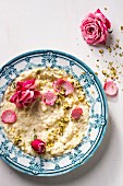 Rice pudding with pistachio nuts and roses