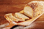 Spelt bread, sliced, on a chopping board