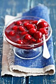 Cherry jam in glass dish