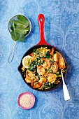 Shrimps with fried rice, spinach, chilli and sesame seeds