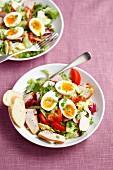 Salad with smoked chicken breast, cherry tomatoes, cucumber and boiled eggs