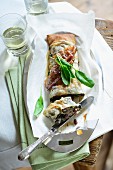 Spinach strudel with marinated raisins and diced bacon