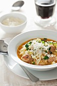 Orzo soup with meatballs, courgette and Parmesan cheese