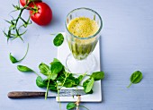 A spinach and cucumber smoothie with tomatoes and tabasco