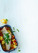 Oven-baked cod on a bed of vegetables