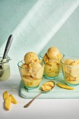 Mango ice cream with an ice cream scoop