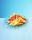 Chilli and jasmine fruit salad on a glass plate