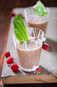 Strawberry and raspberry smoothies in glasses