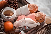 Pine cones and winter picnic in old suitcase