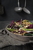 A mixed leaf salad with asparagus, goat's cheese and buffalo worms