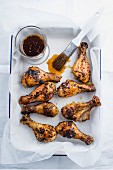 Oven-baked, marinated chicken legs with peppers and a chimichurri sauce