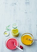 A mustard and dill dressing, mango vinegar and raspberry dressing