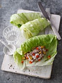 Iceberg lettuce rolls with tuna fish and peppers