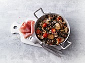 Fried gratinated mushrooms with tomatoes and smoked ham