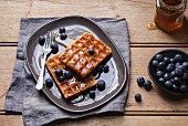 Belgian waffles with blueberries and honey