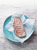 Grilled turkey escalope on a blue plate