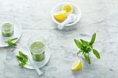 Green smoothies with basil and lemon