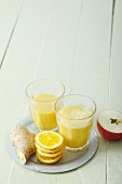 Orange and banana smoothies with apple and ginger