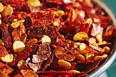 Chilli flakes in a metal bowl