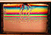 Light refracted off liquid polymer film