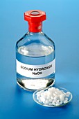 Bottle and pellets of sodium hydroxide
