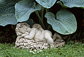 Stone cherub garden ornament