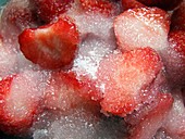 Sliced strawberries covered with sugar