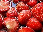 Sliced strawberries in sugary juice