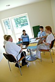 Healthcare workers conduct a meeting