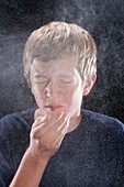Boy sneezing