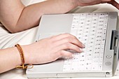 Teenage girl using a laptop computer