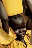 Child carrying water,Uganda