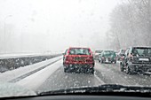 Cars driving through snow