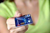 Woman holding a credit card